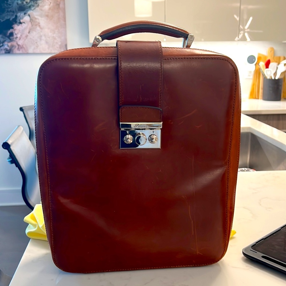Pineider men’s laptop leather bag; $1500 original cost